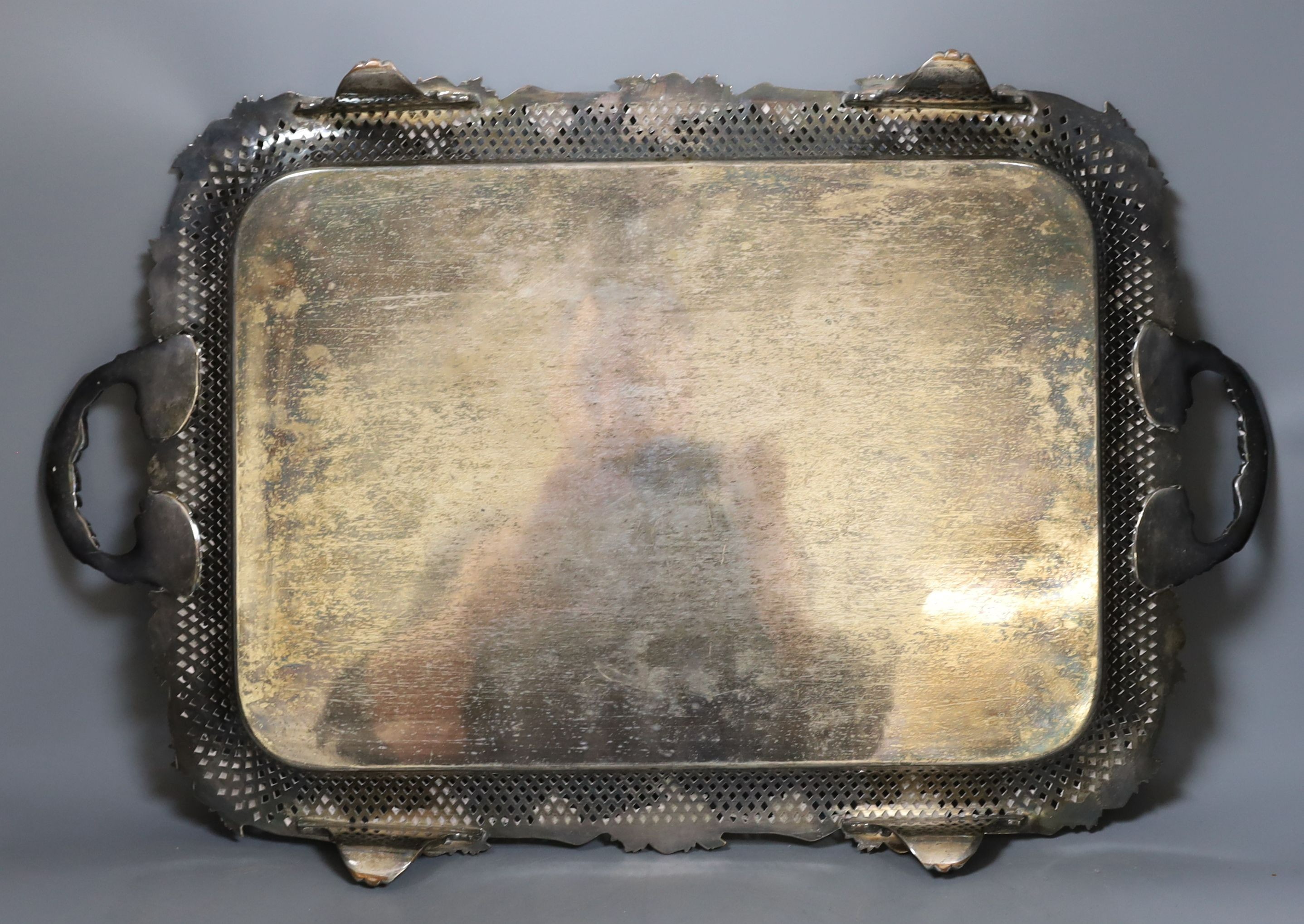 A large electroplate two handled tray, with pierced and vine decoration, 51 cms wide not including handles.